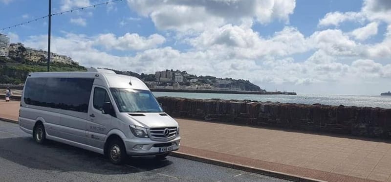 Mawley Minibus silver Mercedes minibus parked on a seafront promenade